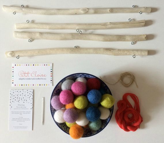 Choose your colors and get to stringing with this fun DIY Felt Ball Mobile Kit. | Petit Eloise