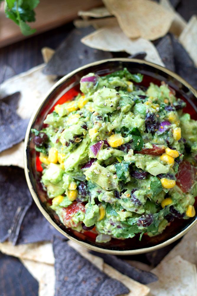 This Southwestern Guacamole will disappear in a heartbeat at your next Cinco de Mayo party—or, really, whenever you serve it! | Kim's Cravings