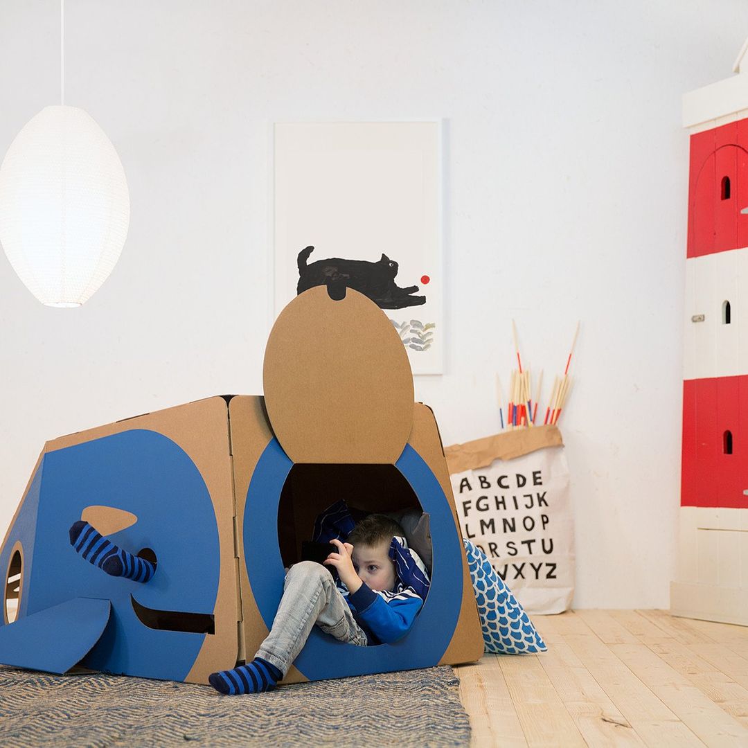 Such cute new cardboard playhouses like this one that lets kids hide out in the belly of a whale. 